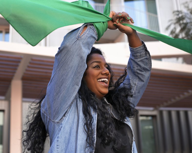 medium-shot-woman-protesting-outdoors